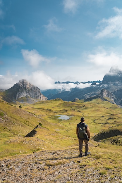 Young adventurous boy trekking in the high mountains Lifestyle relax and freedom