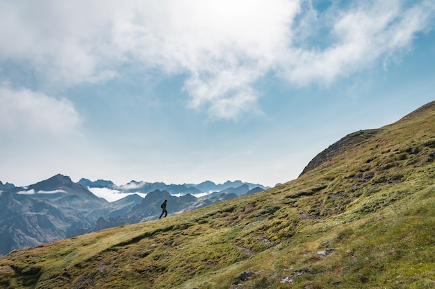 Young adventurous woman trekking in the high mountains Lifestyle relax and freedom