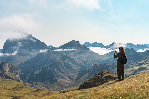 Young adventurous woman trekking in the high mountains Lifestyle relax and freedom