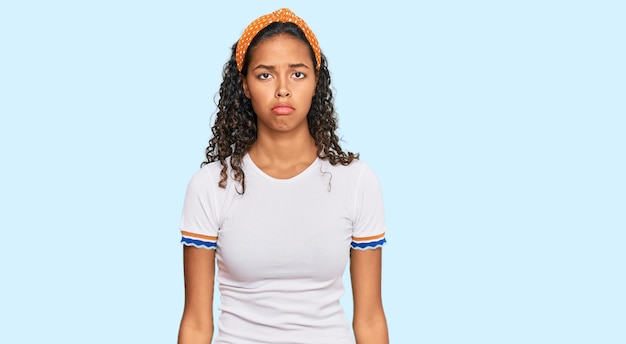 Young african american girl wearing casual clothes depressed and worry for distress, crying angry and afraid. sad expression.