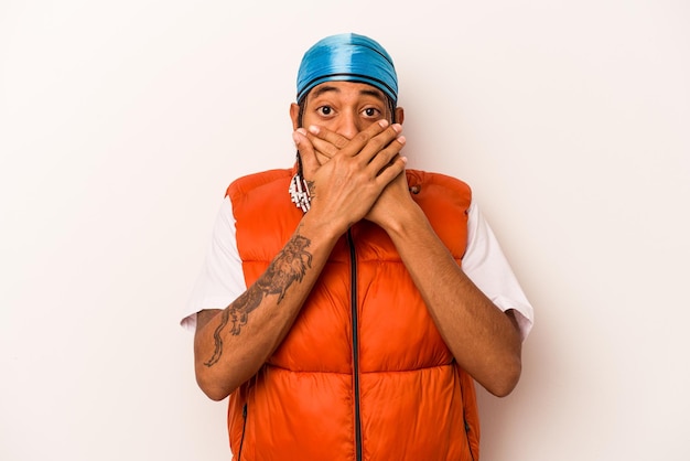 Young African American man isolated on white background shocked covering mouth with hands