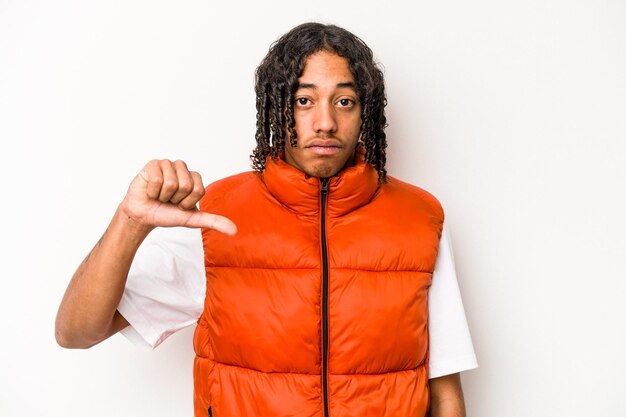 Young African American man isolated on white background showing a dislike gesture thumbs down Disagreement concept