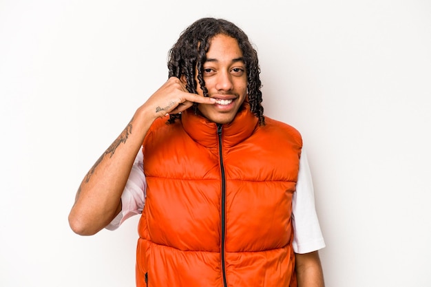 Young African American man isolated on white background showing a mobile phone call gesture with fingers