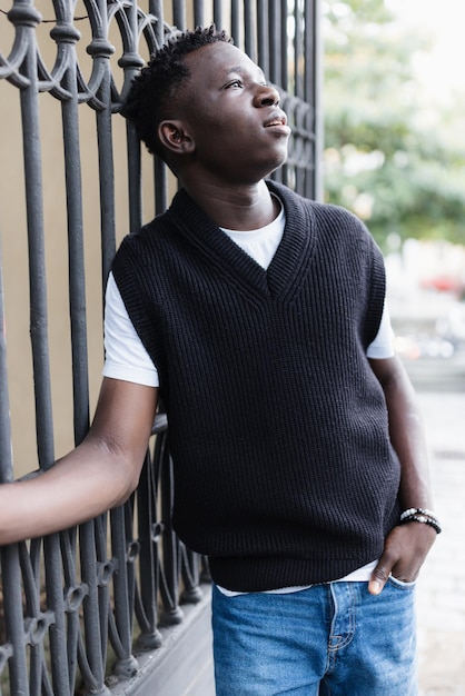 Young African American man outdoor street portrait Fall or spring season