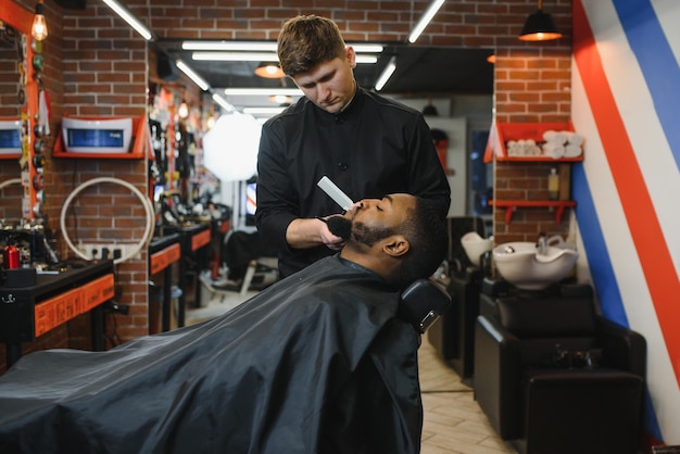 Young African-american man visiting barbershop