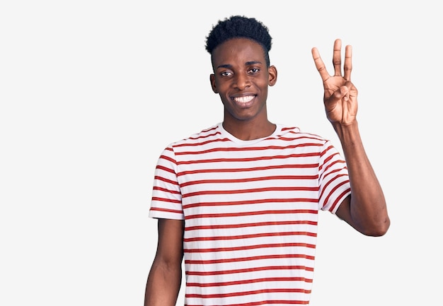 Young african american man wearing casual clothes showing and pointing up with fingers number three while smiling confident and happy