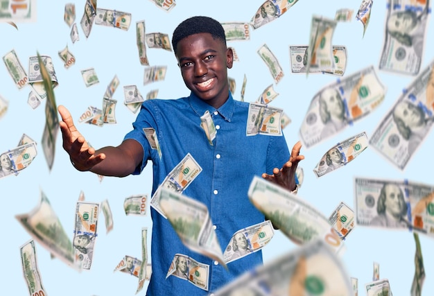 Young african american man wearing casual clothes smiling cheerful offering hands giving assistance and acceptance