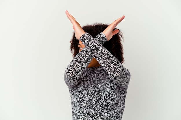 Young african american mixed race woman isolated keeping two arms crossed, denial concept.