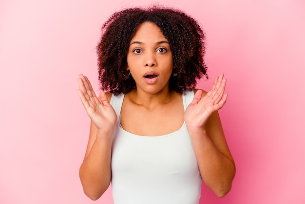 Young african american mixed race woman isolated surprised and shocked.