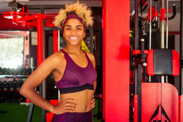 Young african american woman activity working out in gym indoor