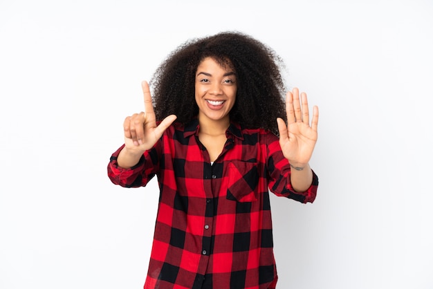 Young african american woman counting seven with fingers