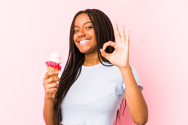 Young african american woman holding an ice cream