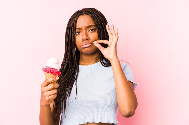 Young african american woman holding an ice cream