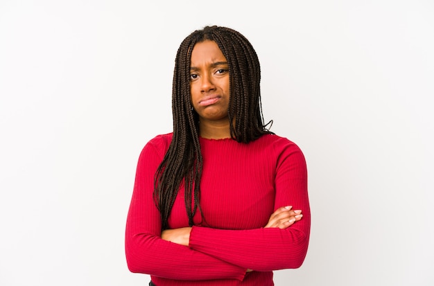 Young african american woman isolated unhappy looking with sarcastic expression.