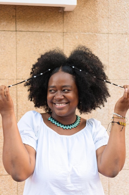 Young African American woman standing and enjoying on the street