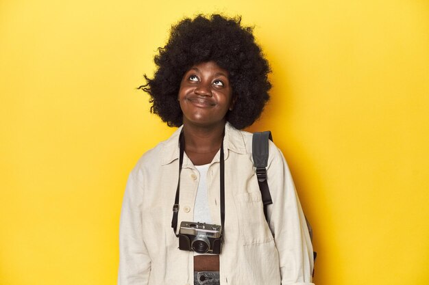 young african american woman with afro hair isolated expressing emotions