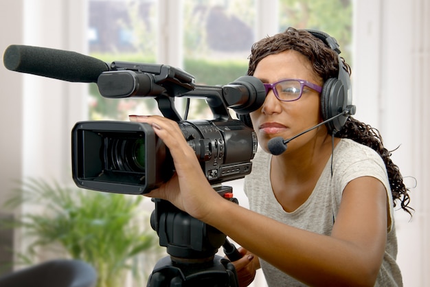 Young African American women with professional video camera