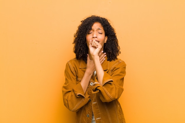 young Afro-American woman posing while coughing