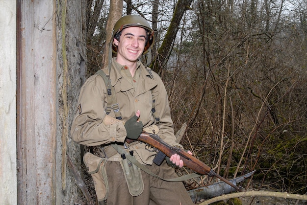 Young American soldier WW2 in the ruins