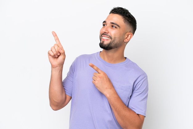 Young Arab handsome man isolated on white background pointing with the index finger a great idea