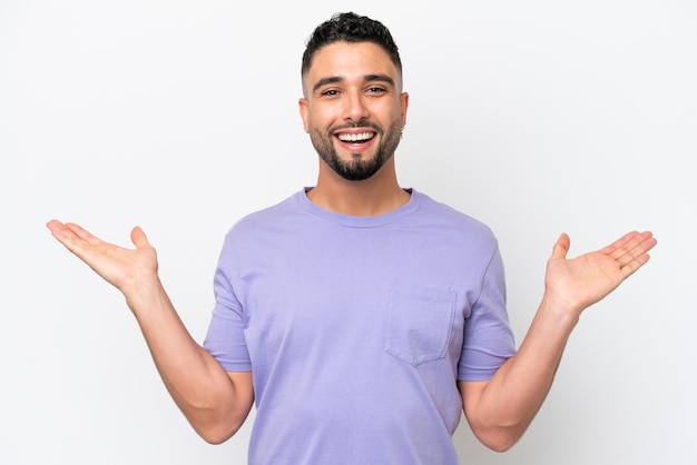 Young Arab handsome man isolated on white background with shocked facial expression