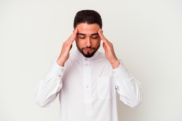 Young arab man wearing typical arab clothes isolated on white touching temples and having headache.