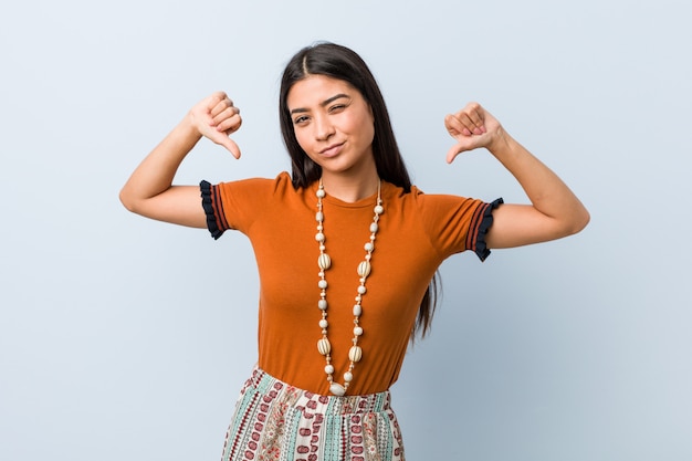 Young arab woman feels proud and self confident, example to follow.