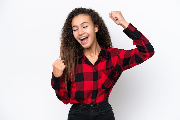 Young Arab woman isolated on white background celebrating a victory