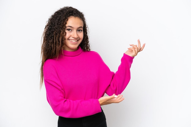 Young Arab woman isolated on white background extending hands to the side for inviting to come