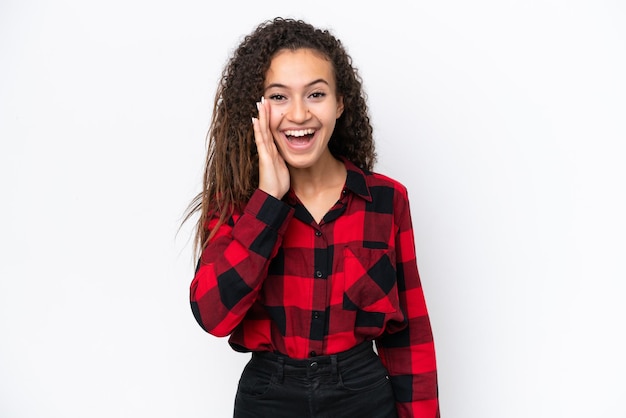 Young Arab woman isolated on white background shouting with mouth wide open