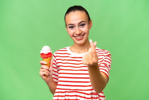 Young Arab woman with a cornet ice cream over isolated background making money gesture