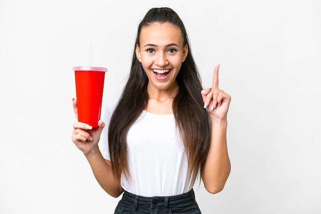 Young Arabian woman holding soda over isolated white background pointing up a great idea