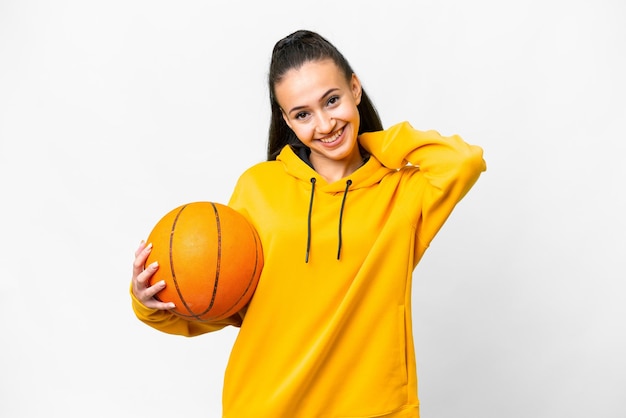 Young Arabian woman playing basketball over isolated white background laughing