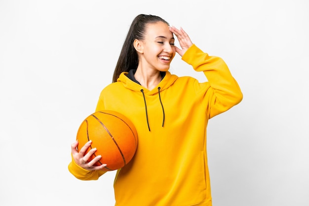 Young Arabian woman playing basketball over isolated white background smiling a lot