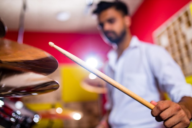 Young arabic man in a professional recording studio