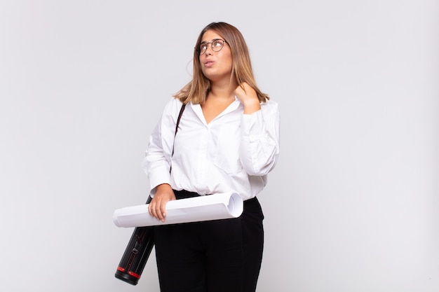 Young architect woman feeling stressed, anxious, tired and frustrated, pulling shirt neck, looking frustrated with problem