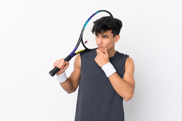 Young Argentinian man playing tennis and thinking