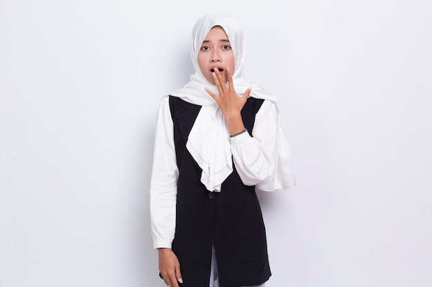 Young asian beautiful muslim woman shocked covering mouth with hands for mistake isolated on white