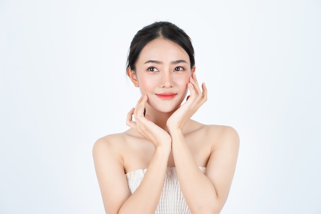 Young asian beautiful woman in white undershirt, has healthy and bright skin.