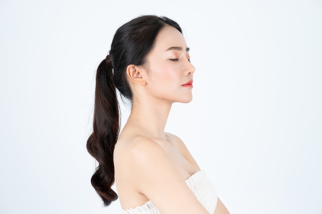 Young Asian beautiful woman in white undershirt, has healthy and bright skin.