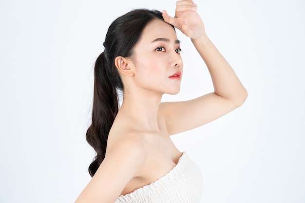 Young Asian beautiful woman in white undershirt, has healthy and bright skin.