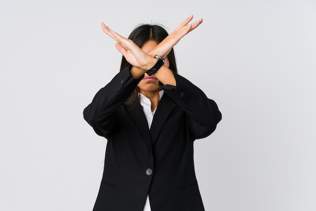 Young asian business woman keeping two arms crossed