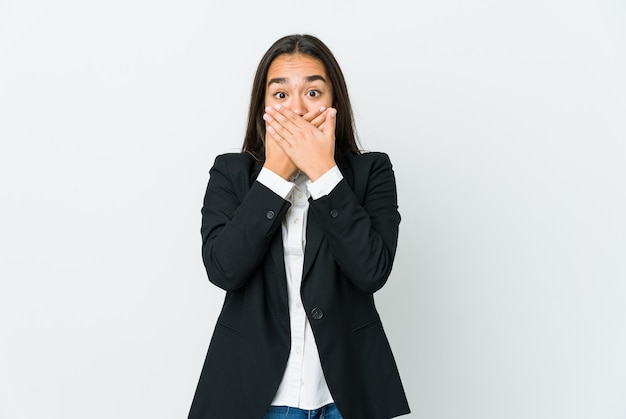 Young asian business woman shocked covering mouth with hands.