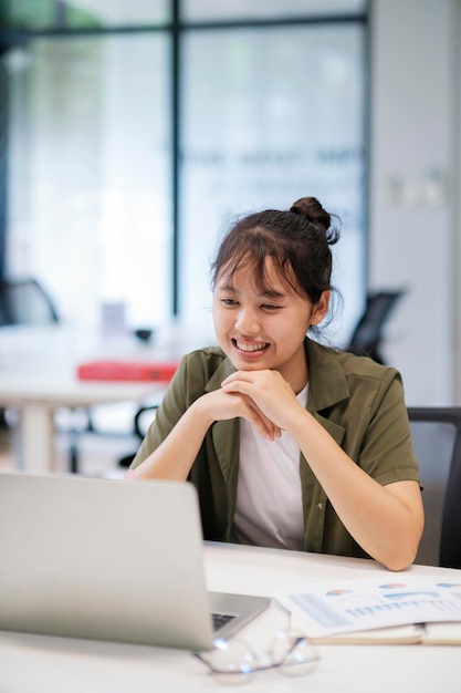 Young asian business woman or student working online on computer laptop