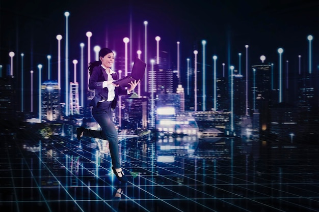 Young asian businesswoman holding a smart phone walking with futuristic smart city background