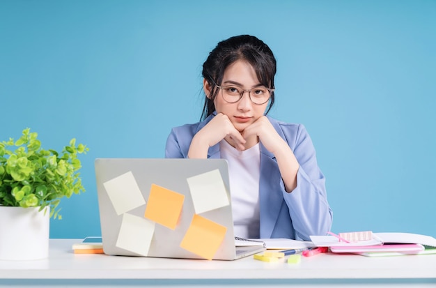 Young Asian businesswoman working on background