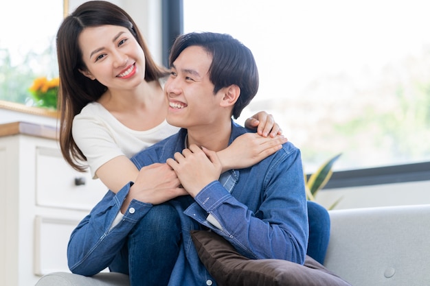 Young Asian couple chatting happily