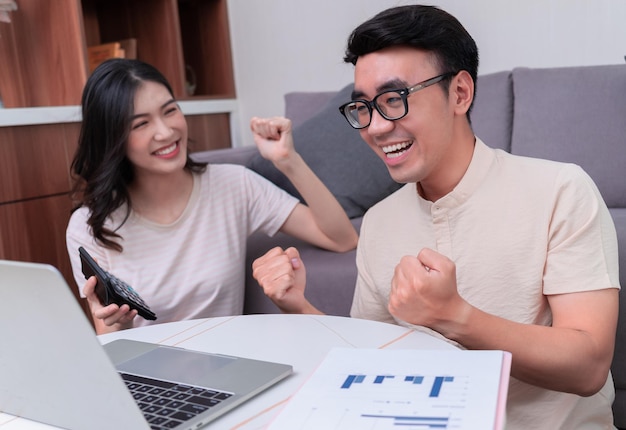 Young Asian couple at home