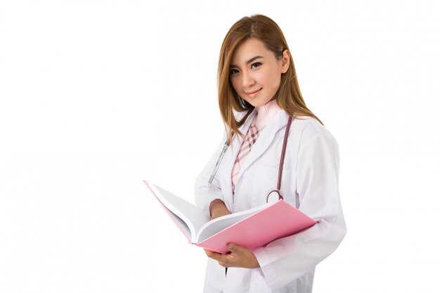 Young Asian doctor woman smile face reading book with stethoscope on her shoulder