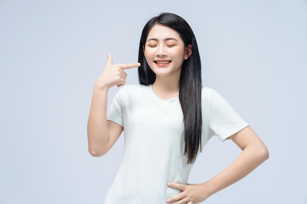 Young Asian girl posing on background